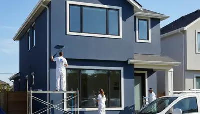 House painters in Escondido, CA applying a clean, lasting exterior finish on a home